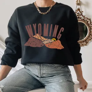 Women's Wyoming Mountains Crewneck Sweatshirt Distressed Wyoming Design in a Cozy, Warm Winter Adventure Camping Hiking Pullover